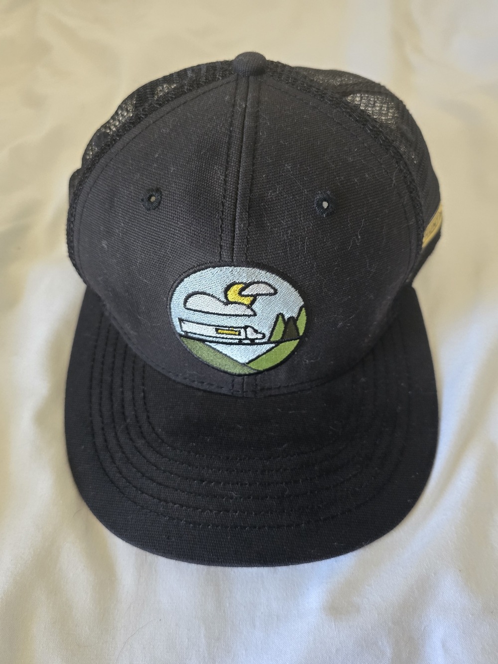 Black Trucker Hat with Outdoor Patch